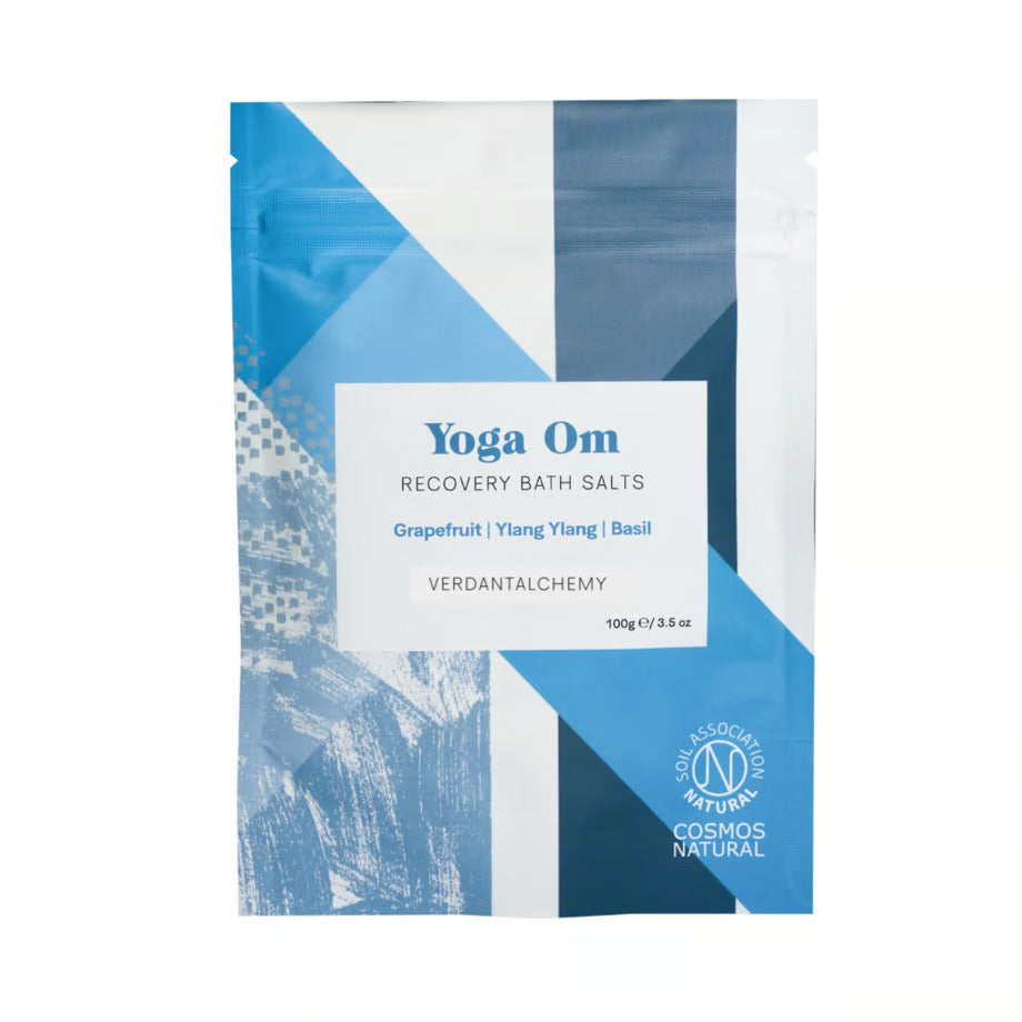 Packaging of Verdant Alchemy Yoga Om Bath Salts with geometric patterns in blue and white colors, and product details written on it.